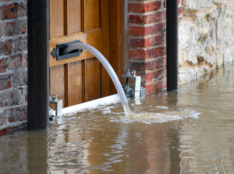 Flood water being pumped out of house in York, UK.